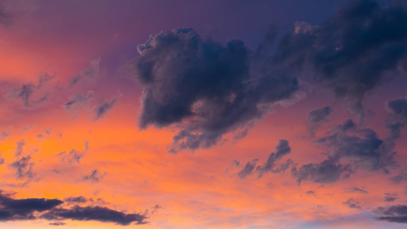 Sunset Clouds Over Orange and Purple Sky