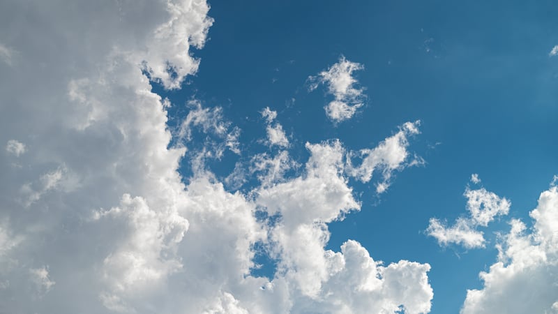 White clouds against a bright blue sky