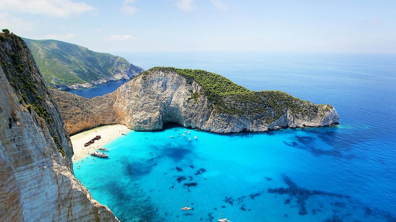 Shipwreck beach with turquoise water and cliffs