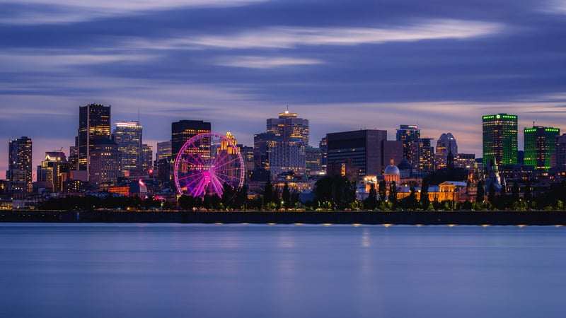 Montreal skyline at dusk with a Ferris wheel