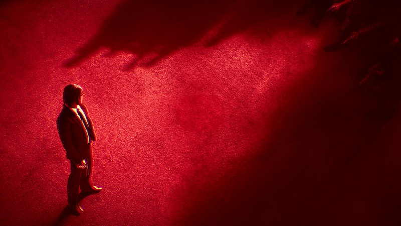 John Wick on a red carpet with shadows