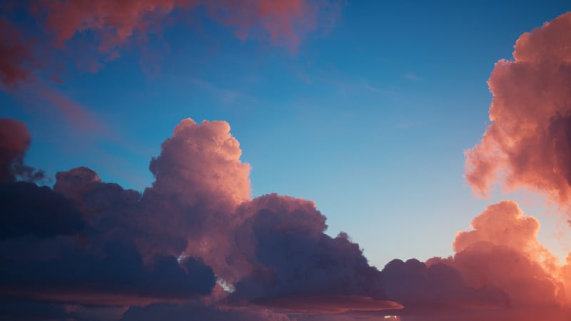 Pink and orange clouds against a blue sky