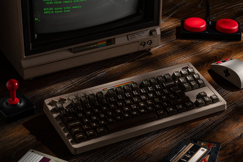 Retro computer setup with cassette, keyboard, and joystick
