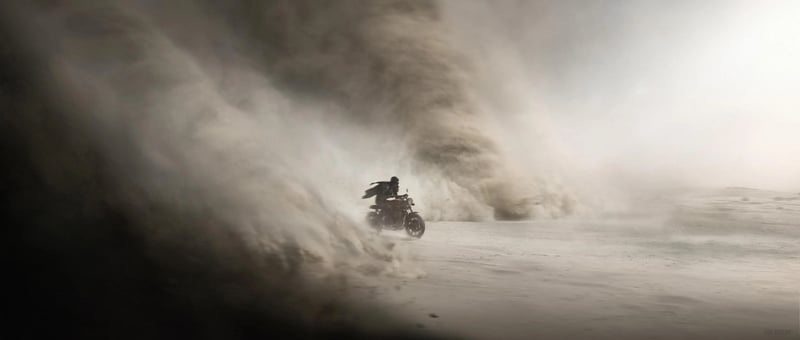 Motorcycle driving through a dust storm