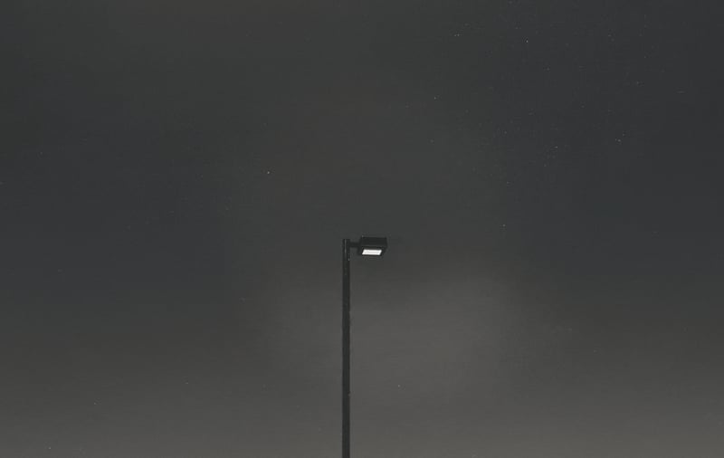 Street light against a dark, starry sky