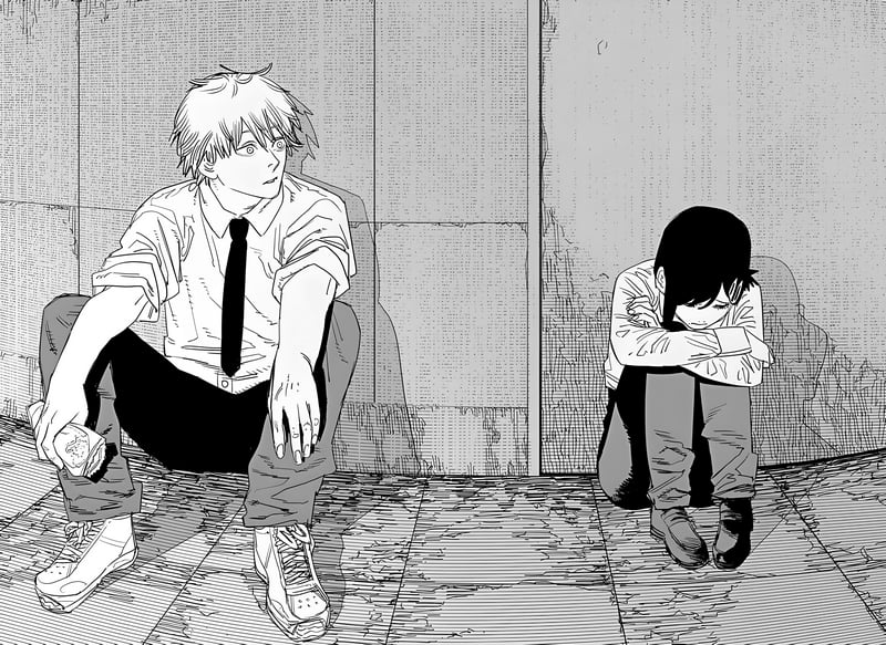 Denji and Kobeni sitting on the ground