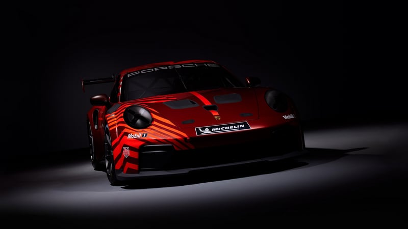 Red Porsche race car with racing decals