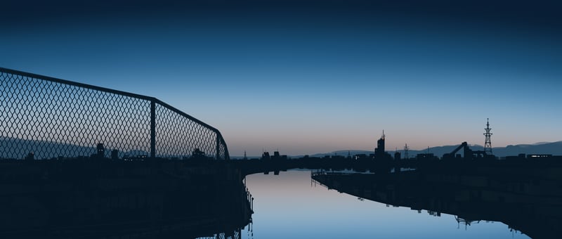 City skyline reflected in a river at dusk
