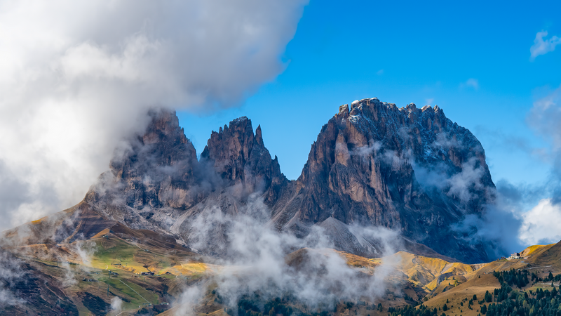 Clouds obscuring rocky mountain peaks in the Dolomites