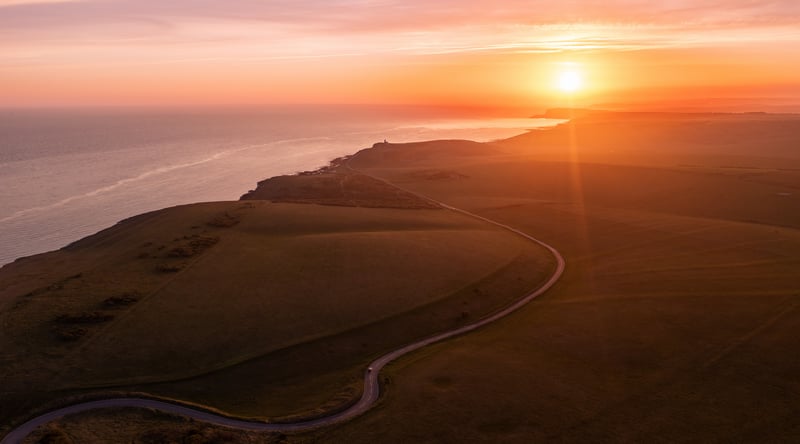 Coastal road at sunset with ocean view