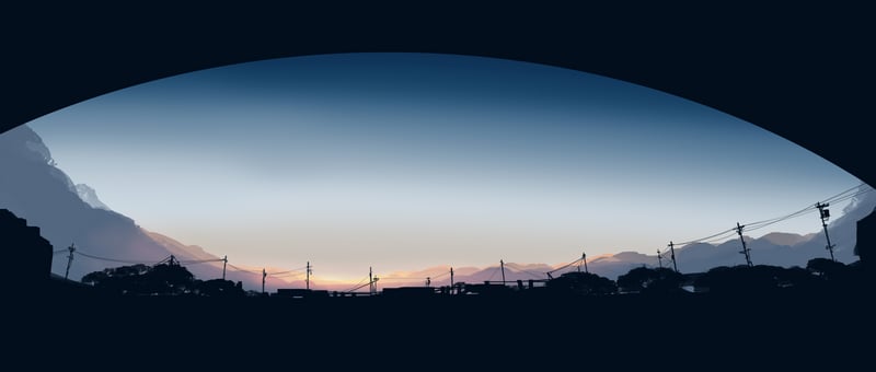 Silhouette of a town against a sunrise sky