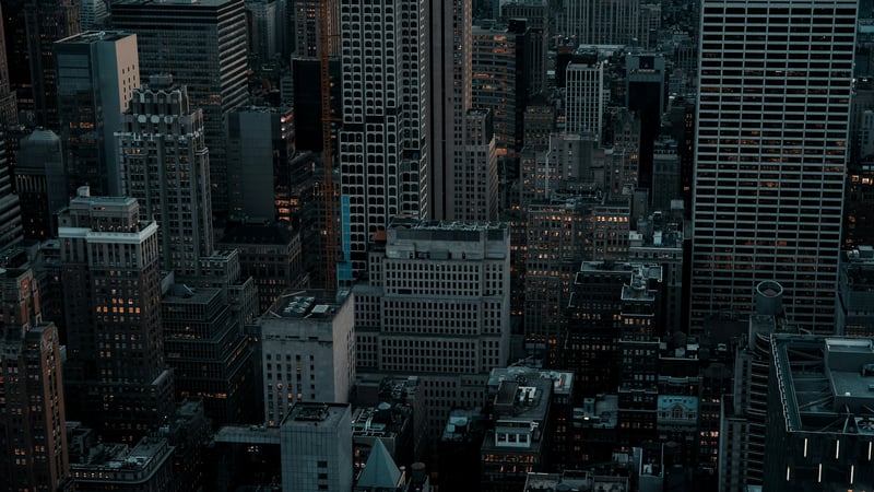 Dark Cityscape with Tall Buildings and Rooftops
