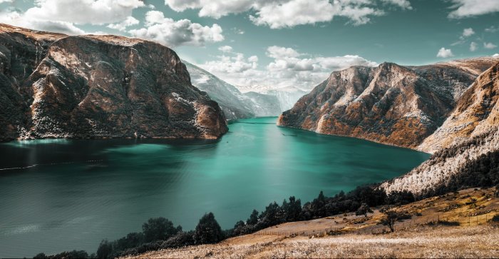 Turquoise Fjord Between Steep Rocky Mountains