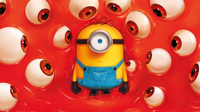 Stuart the Minion surrounded by giant eyeballs