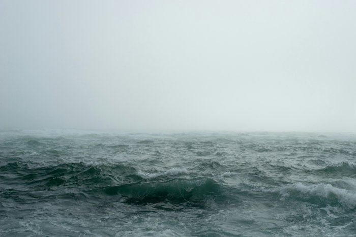 Stormy Ocean Waves Under a Foggy Sky