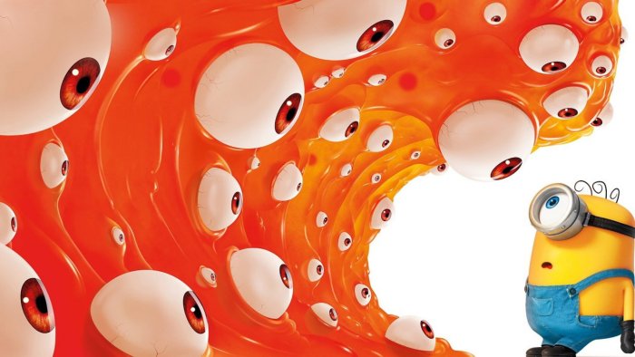 A Minion facing a giant orange eyeball monster