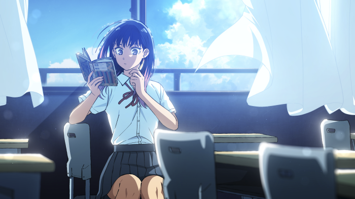 Shiori Goshiki reading a book in a classroom