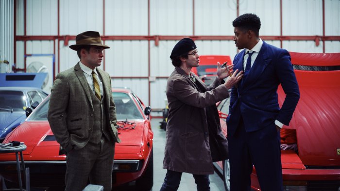 Three Men in Suits and Classic Cars in Chapter 51