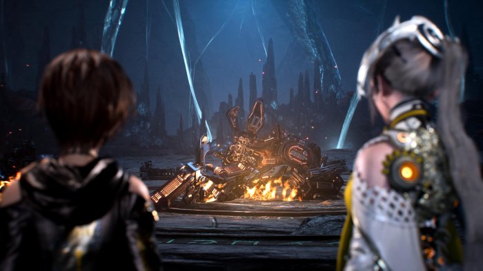 Eve and Lily looking at burning machine in Stellar Blade