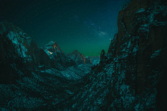 Starry night sky over snow-dusted Zion Canyon