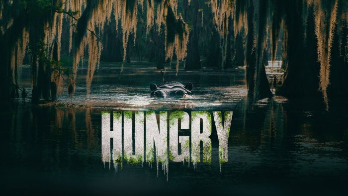 Movie poster for Hungry featuring a hippopotamus in a swamp