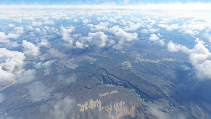 High Altitude Aerial View of Earth and Clouds