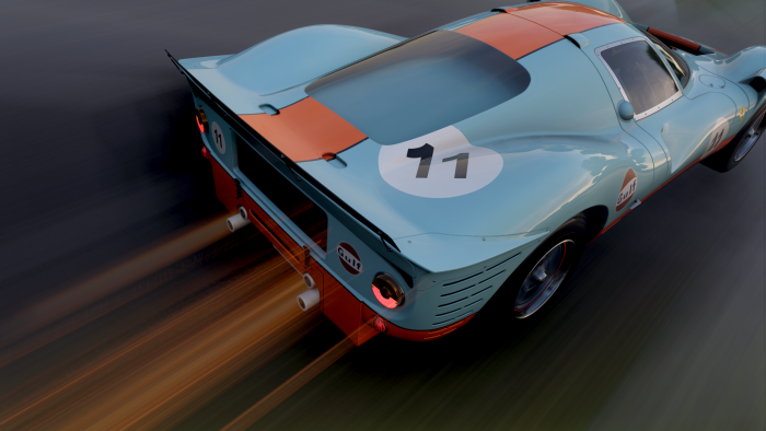 Classic Race Car in Gulf Livery Speeding on Track