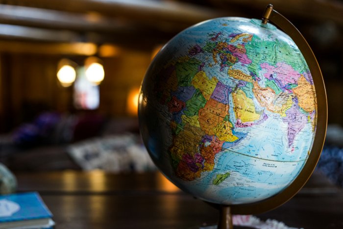 Vintage desk globe on a wooden table