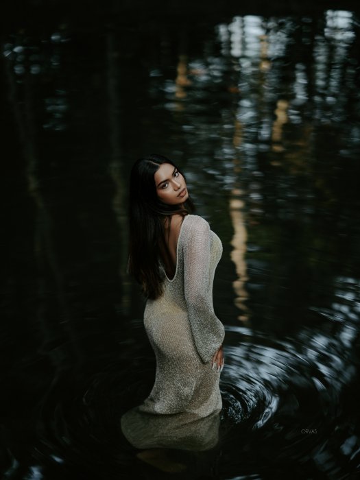 Model Archana Das posing in dark water