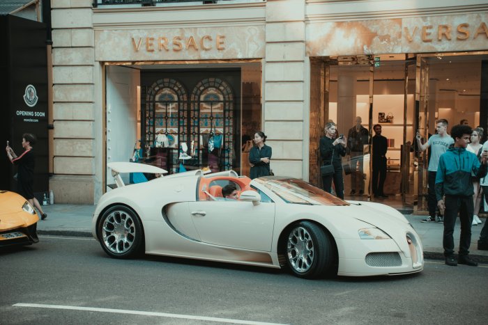 White Bugatti Veyron Roadster in Front of Versace Store