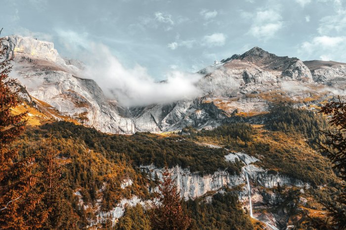 Mountain Range with Forest and Waterfall
