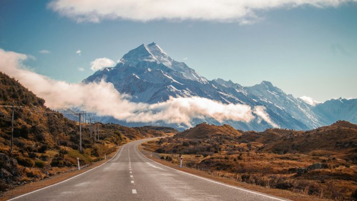 Empty road winding towards Mount Cook