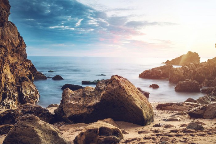Rocky Shoreline of Little Corona Beach at Sunrise