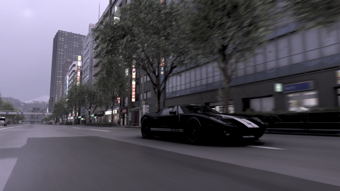 Black Ford GT Speeding on City Street
