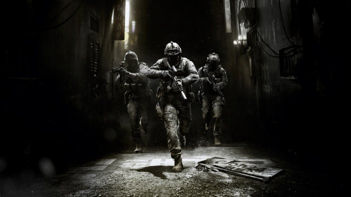 Three soldiers in tactical gear running through a dark alley