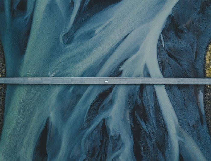 Aerial view of a bridge over a braided river