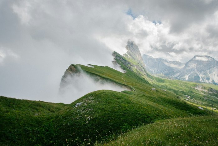 Green Slopes of Seceda Mountain in Fog
