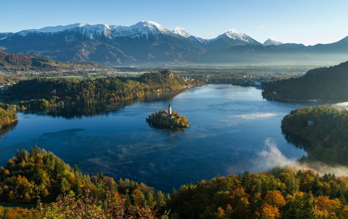 Lake Bled Island Church and Snow Capped Mountains