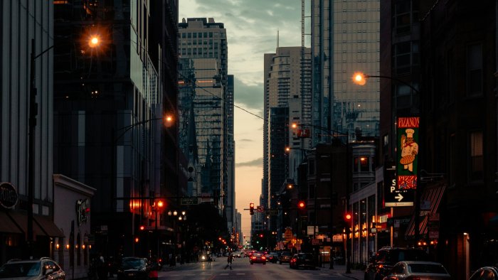 City street with tall buildings at dusk