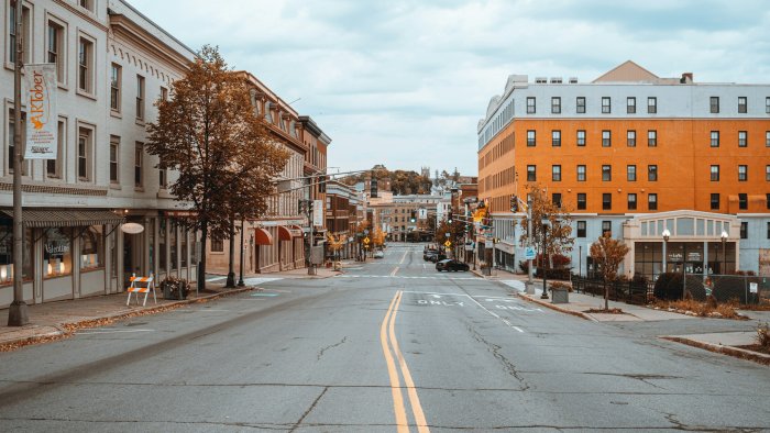 Empty asphalt street lined with buildings in Bangor