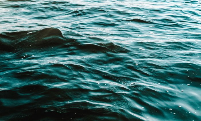 Dark Teal Ocean Waves Rippling on Water Surface