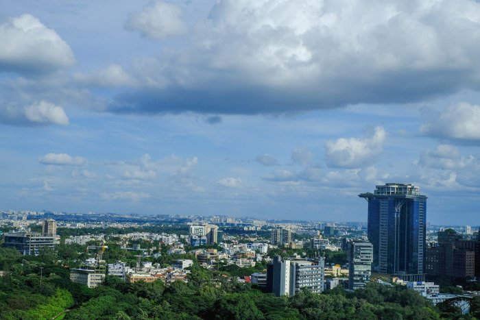 City skyline with skyscrapers and green trees