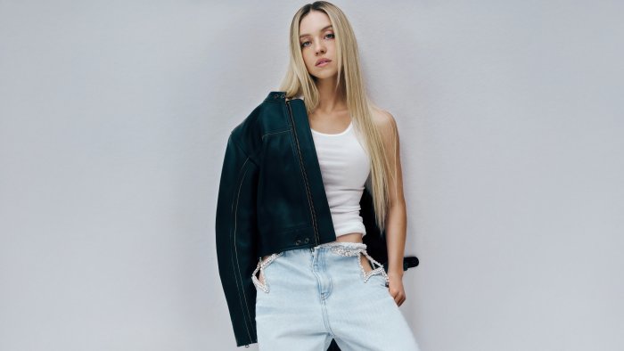 Sydney Sweeney in Leather Jacket and Cutout Jeans