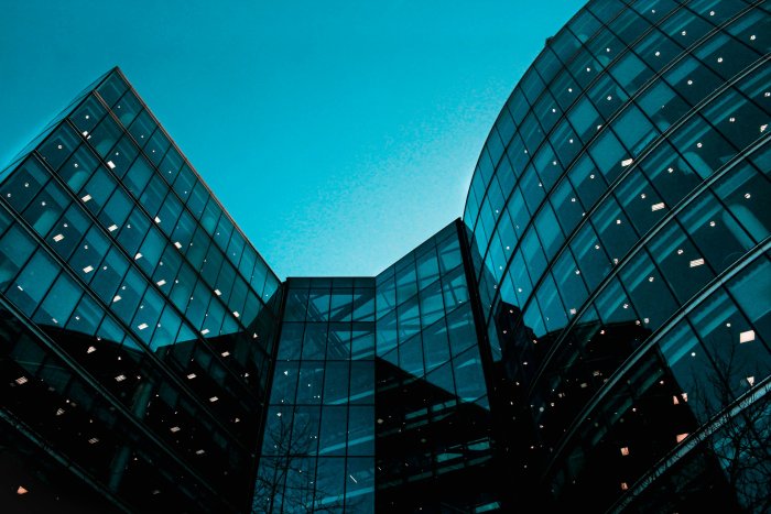 Low Angle View of Glass Walled High Rise Buildings