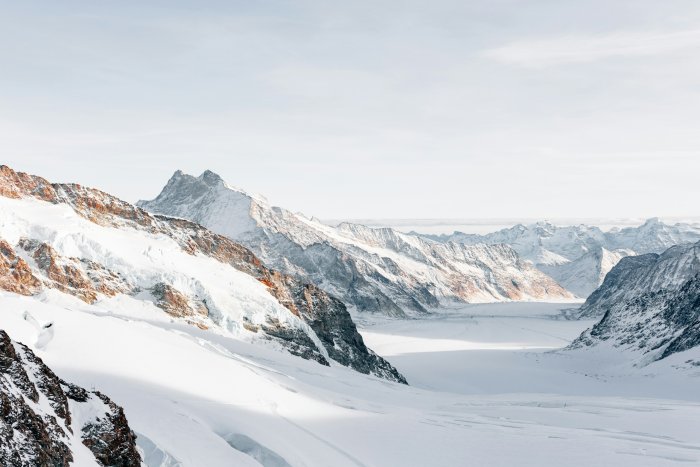 Snow-covered Swiss Alps and glacier valley