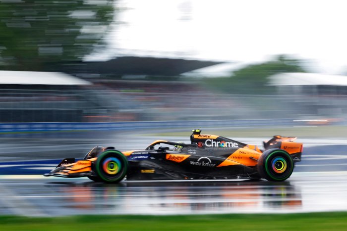 McLaren Formula 1 Car on Wet Racetrack