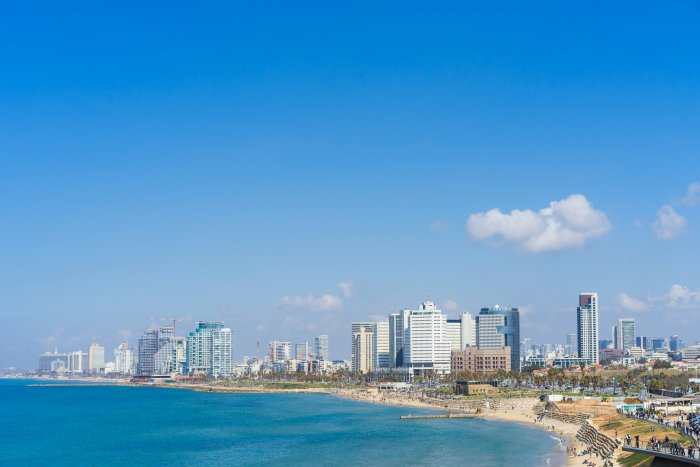 Coastal City Skyline Along Blue Sea and Beach