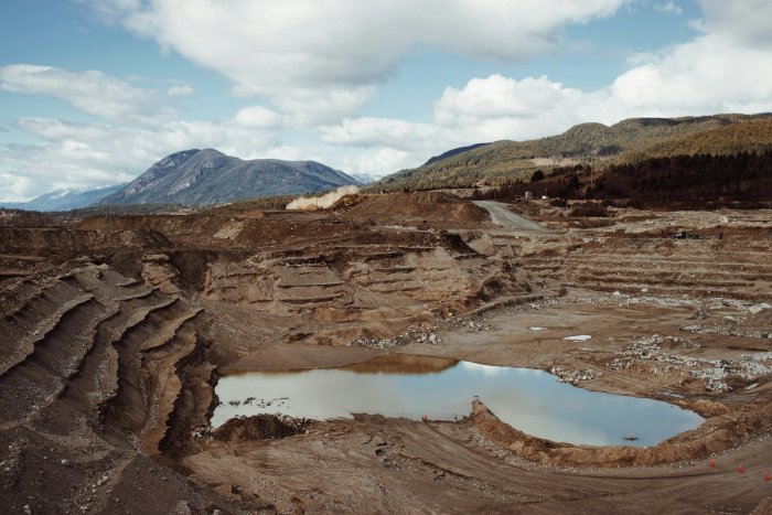 Open-Pit Mine with Mountain Background