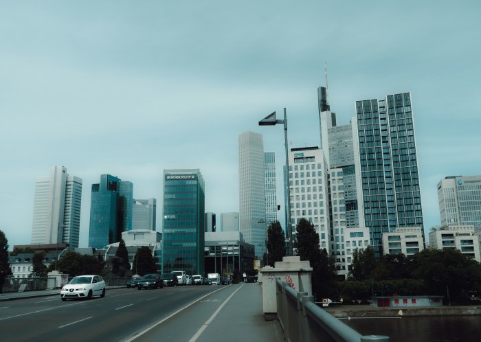 Modern City Skyline with Skyscrapers and Bridge Traffic