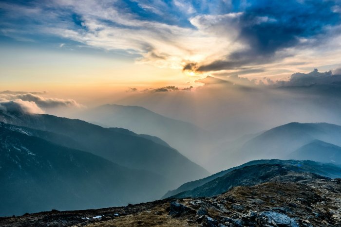 Himalayan mountain range at sunset with sunbeams